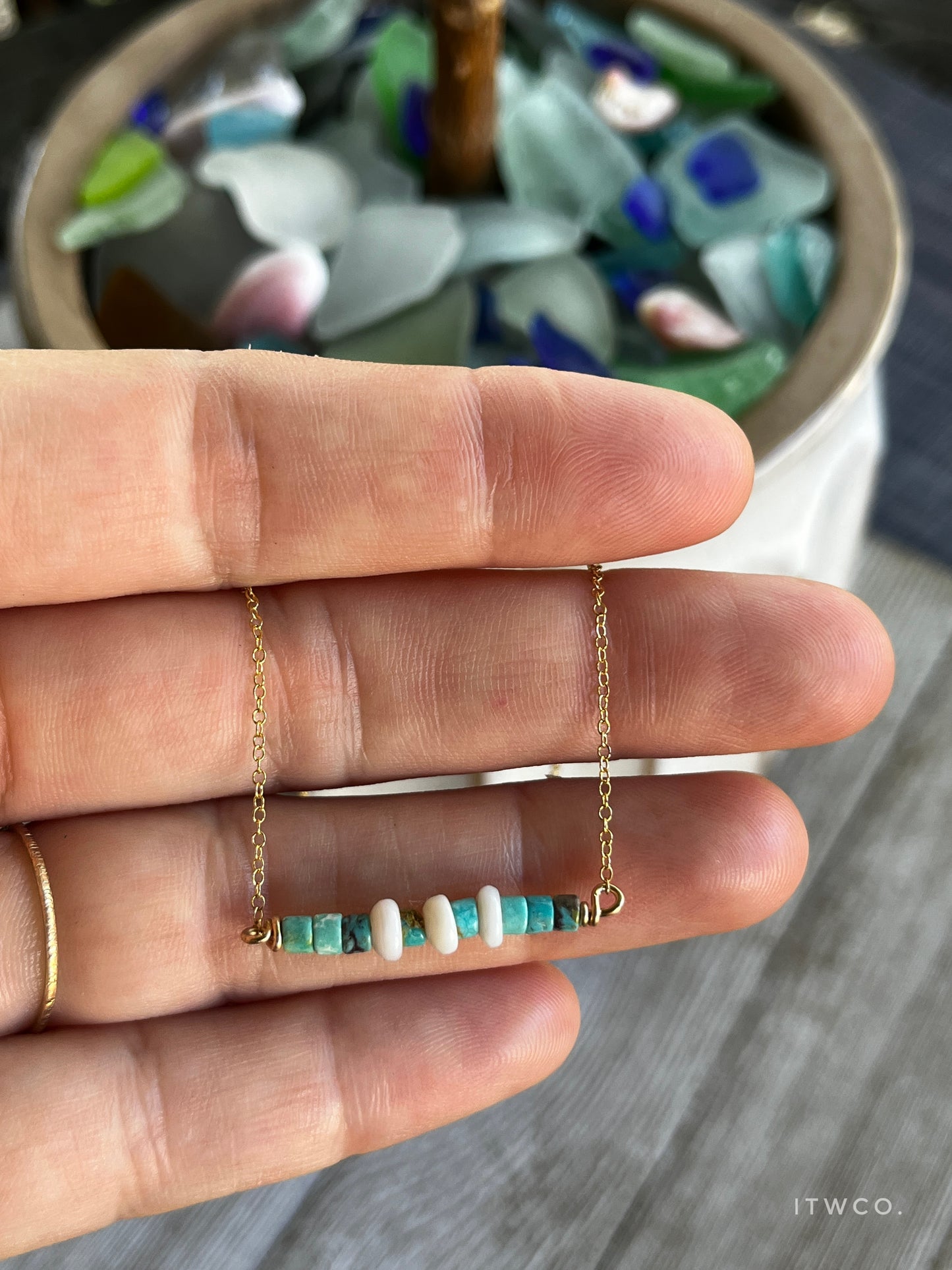 The Merchant Necklace in puka shell or herkimer diamond