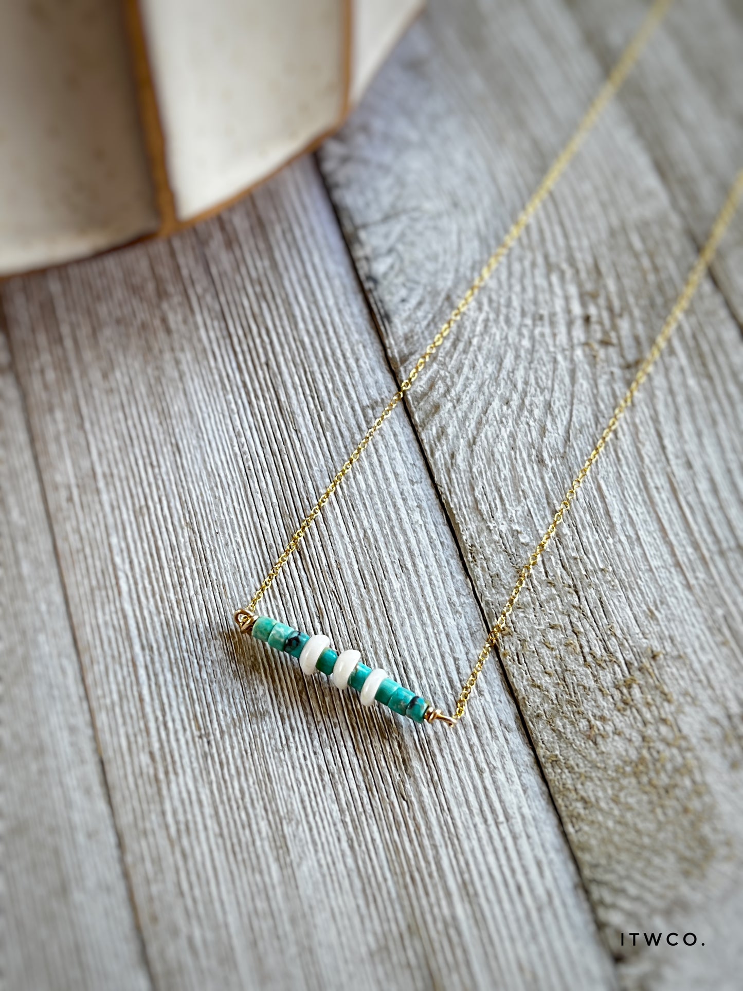 The Merchant Necklace in puka shell or herkimer diamond